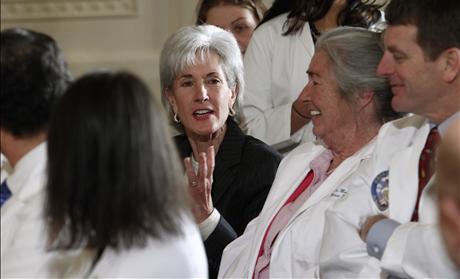 U.S. Health and Human Services Secretary Sebelius talks with medical professionals before U.S. President Barack Obama's speech on healthcare reform in Washington