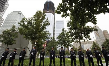 NYPD officers, FDNY firefighters and Port Authority Police line up at one of the entrances of 9/11 Memorial Plaza during ceremonies marking the 10th anniversary of the 9/11 attacks on the World Trade Center, in New York, September 11, 2011.