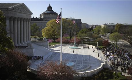 People rally as legal arguments over the Patient Protection and Affordable Care Act at the Supreme Court in Washington 