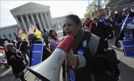 Obama healthcare law supporters rally during the third and final day of legal arguments over the Patient Protection and Affordable Care Act in Washington 