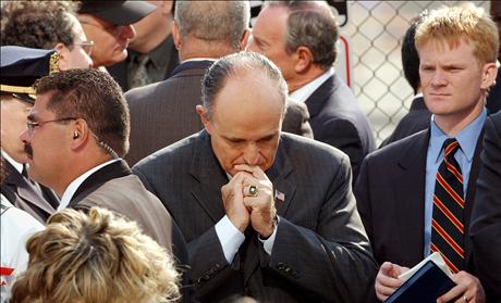 FORMER NEW YORK MAYOR GIULIANI PAUSES DURING CEREMONIES MARKING SEPTEMBER 11 ATTACKS.