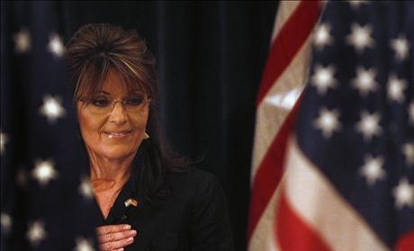 Former Alaska governor Sarah Palin looks down during the Pledge of Allegiance before speaking to the LIA Annual Meeting & Luncheon at the Crest Hollow Country Club in Woodbury