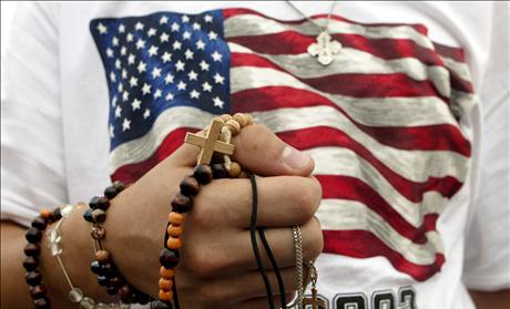 PILGRIM HOLDS ROSARY DURING PAPAL WELCOMING CEREMONY IN TORONTO.