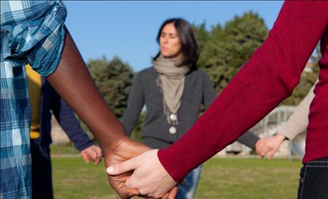 Multiracial Young People Holding Hands in a Circle