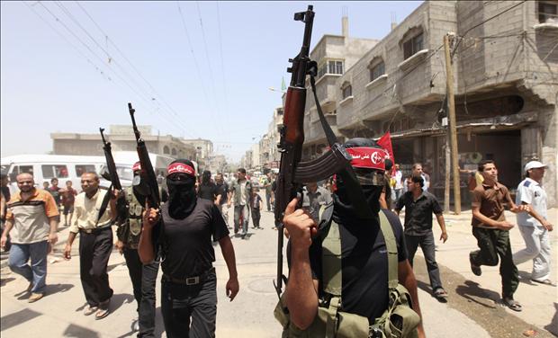 Palestinian militants attend the funeral of Bassam Badwan in Gaza City