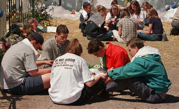 COLUMBINE HIGH SCHOOL BIBLE CLUB MEETS AT MEMORIAL SITE IN LITTLETON.