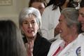 U.S. Health and Human Services Secretary Sebelius talks with medical professionals before U.S. President Barack Obama's speech on healthcare reform in Washington 