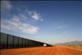 A U.S. Border vehicle drives along the U.S. and Mexico border fence in Naco, Arizona
