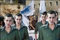 Israeli demonstrators holds flags behind cardboard cut-outs of captured Israeli soldier Gilad Shalit outside PM's office in Jerusalem