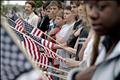 Local residents line the street as the funeral procession for Marine Lance Cpl. Walter O'Haire passes in Rockland