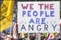 Protestors hold signs as several groups hold a 'Kill the Bill' rally against Obama's health care legislation, on the west front of the U.S. Capitol in Washington