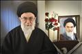 Iran's Supreme Leader Ayatollah Ali Khamenei sits next to a portrait of late leader Ayatollah Ruhollah Khomeini in Tehran