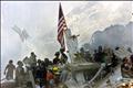 A U.S. flag is posted in the rubble of the World Trade Center September 13, 2001, in New York.