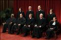 Justices of the U.S. Supreme Court pose for formal group photo in the East Conference Room in Washington