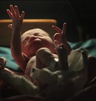 A baby gestures minutes after he was born inside the pediatric unit at hospital Escuela in Tegucigalpa