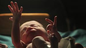 A baby gestures minutes after he was born inside the pediatric unit at hospital Escuela in Tegucigalpa